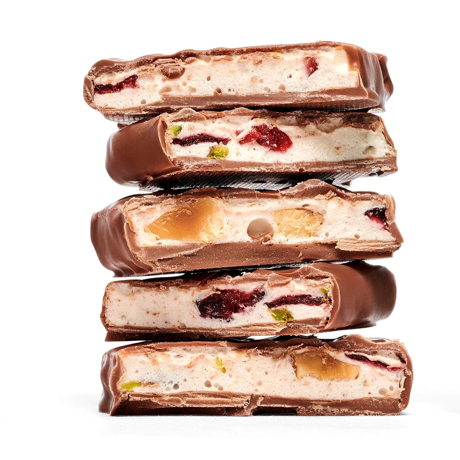 Stack of chocolate-covered candy bars with visible fillings on a white background
