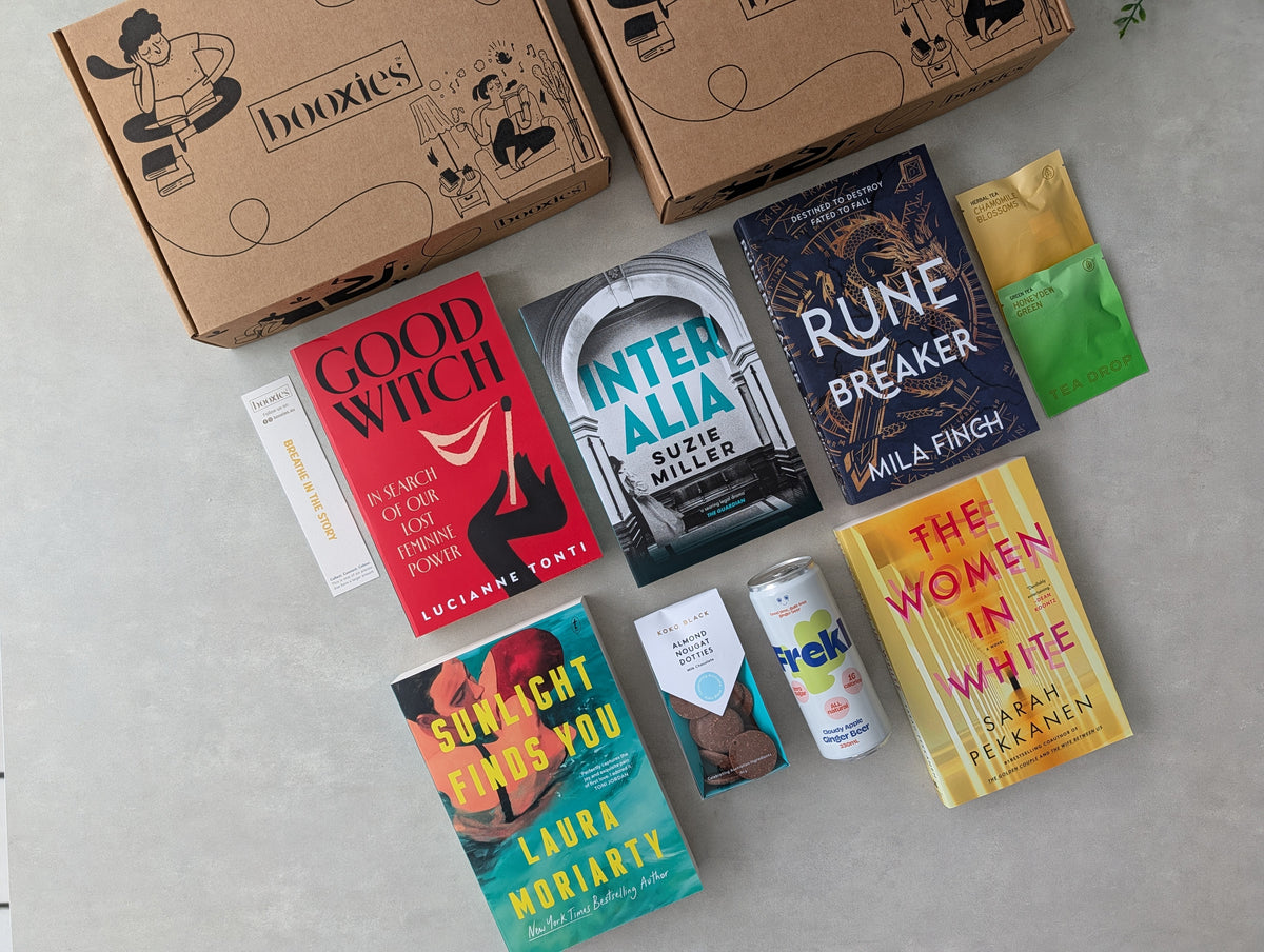 October premium mystery booxies books and products on a flatlay