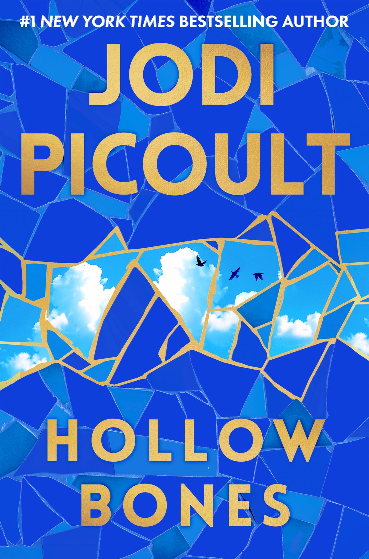 Book cover of 'Hollow Bones' by Jodi Picoult with blue mosaic design and sky elements.