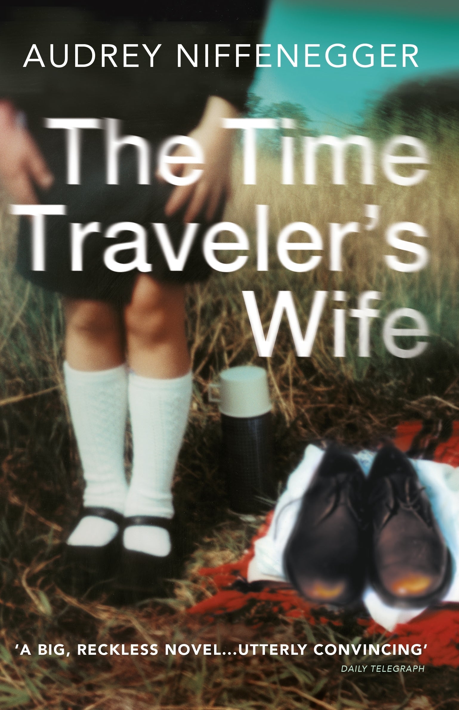 Book cover of 'The Time Traveler's Wife' by Audrey Niffenegger with a person in white socks and shoes in a field.