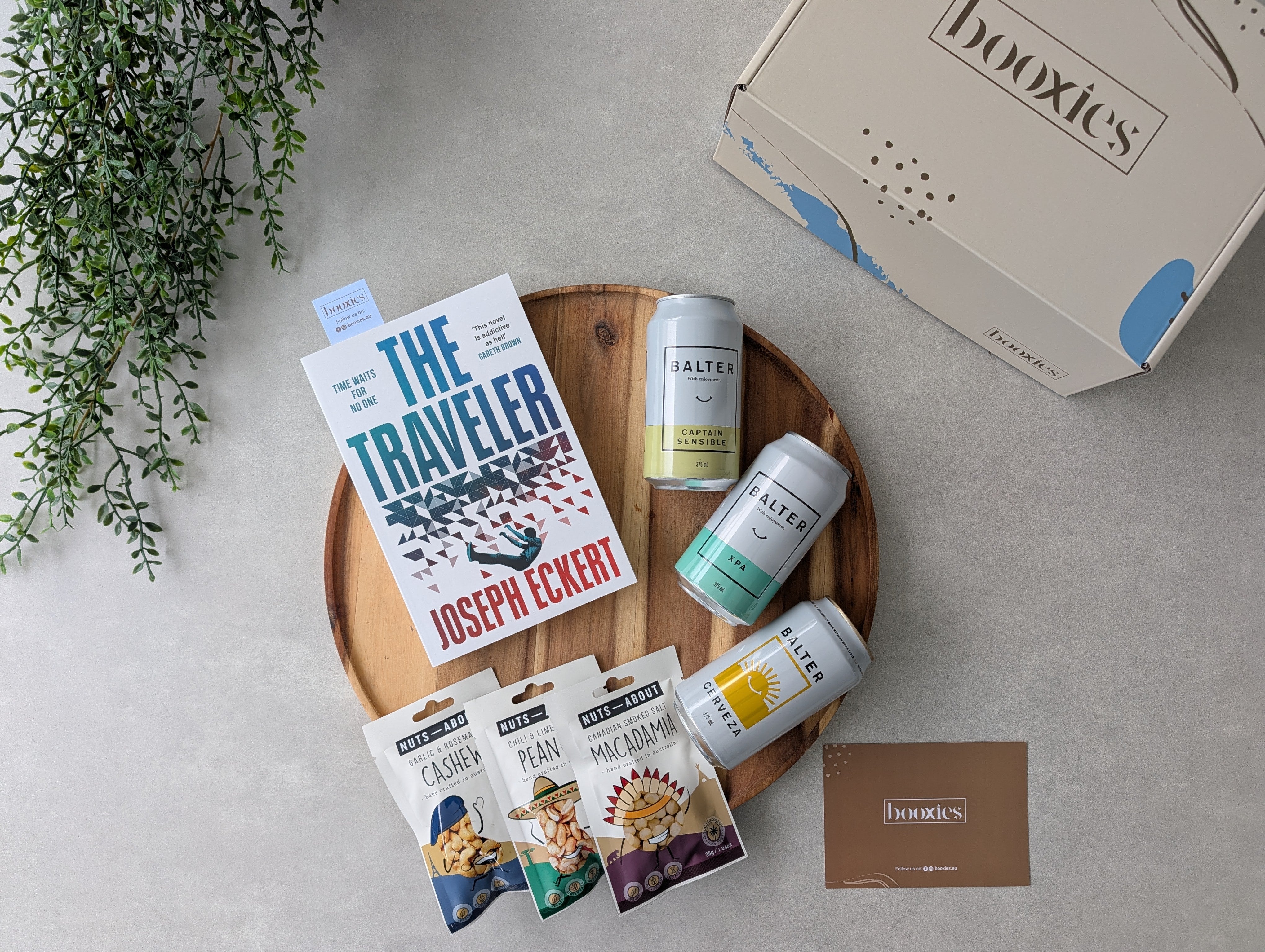 happy hours crated beer and roasted nuts with a book gift flatlay