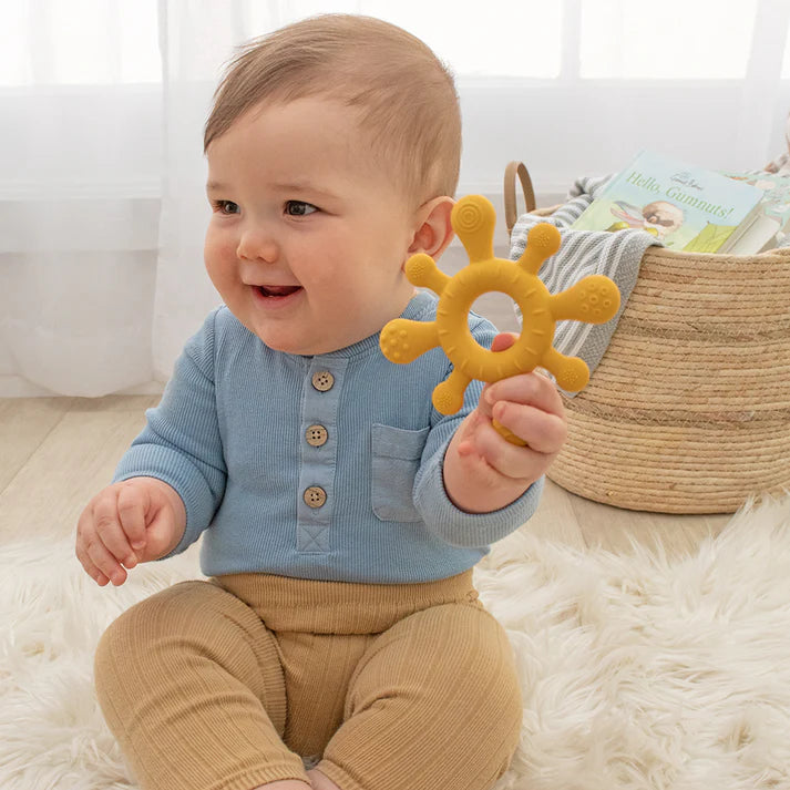 Living Textile Teether in the hand of a baby