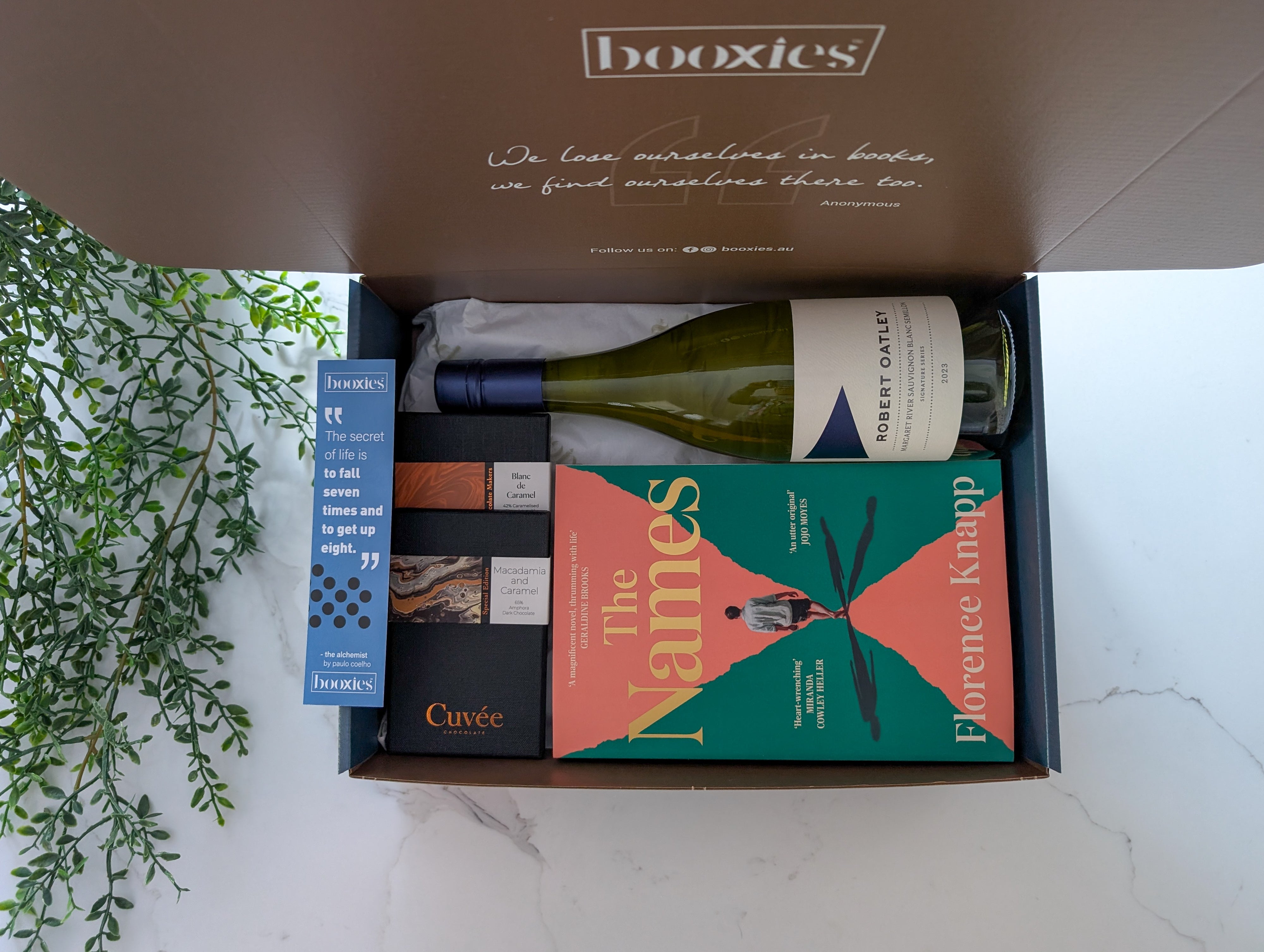 read n wine gift box with a book from your preferred genre and a bottle of wine paired with hand made chocolate