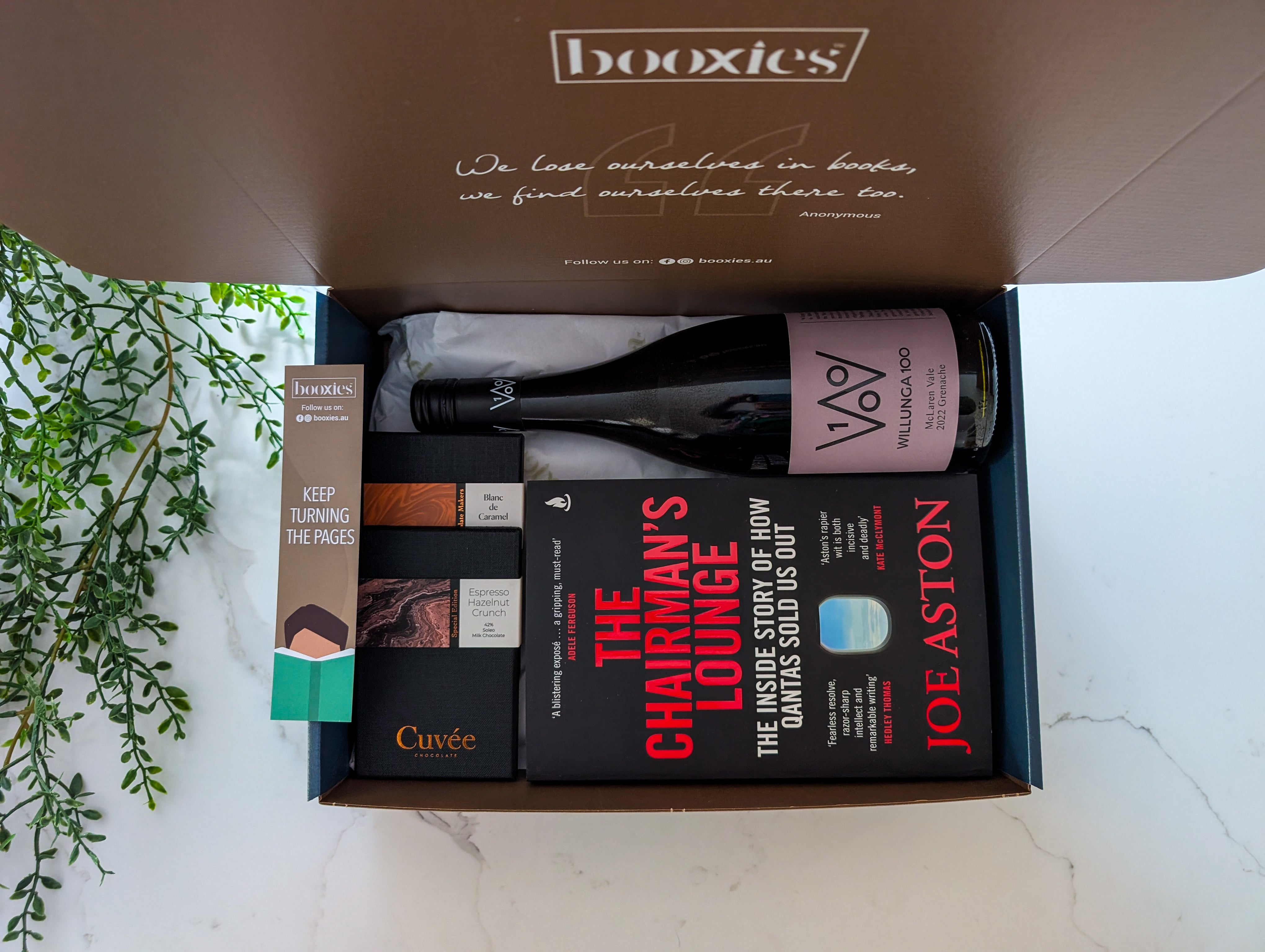 read n wine gift box with a book from your preferred genre and a bottle of wine paired with hand made chocolate