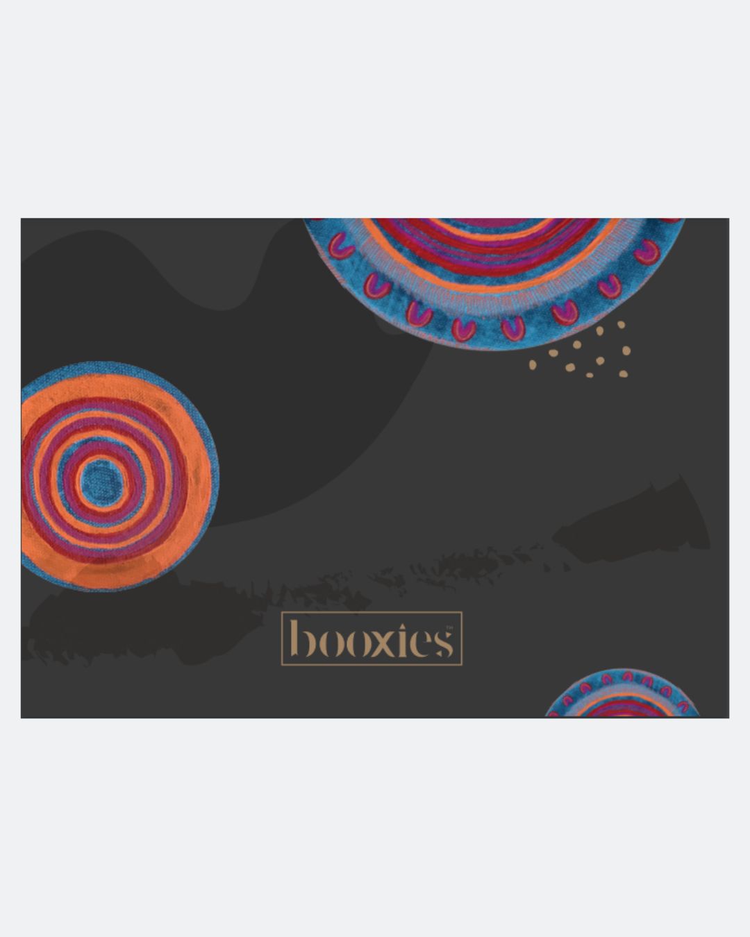 Product packaging with colorful Aboriginal circular designs on a dark background, featuring the brand 'booxies'.