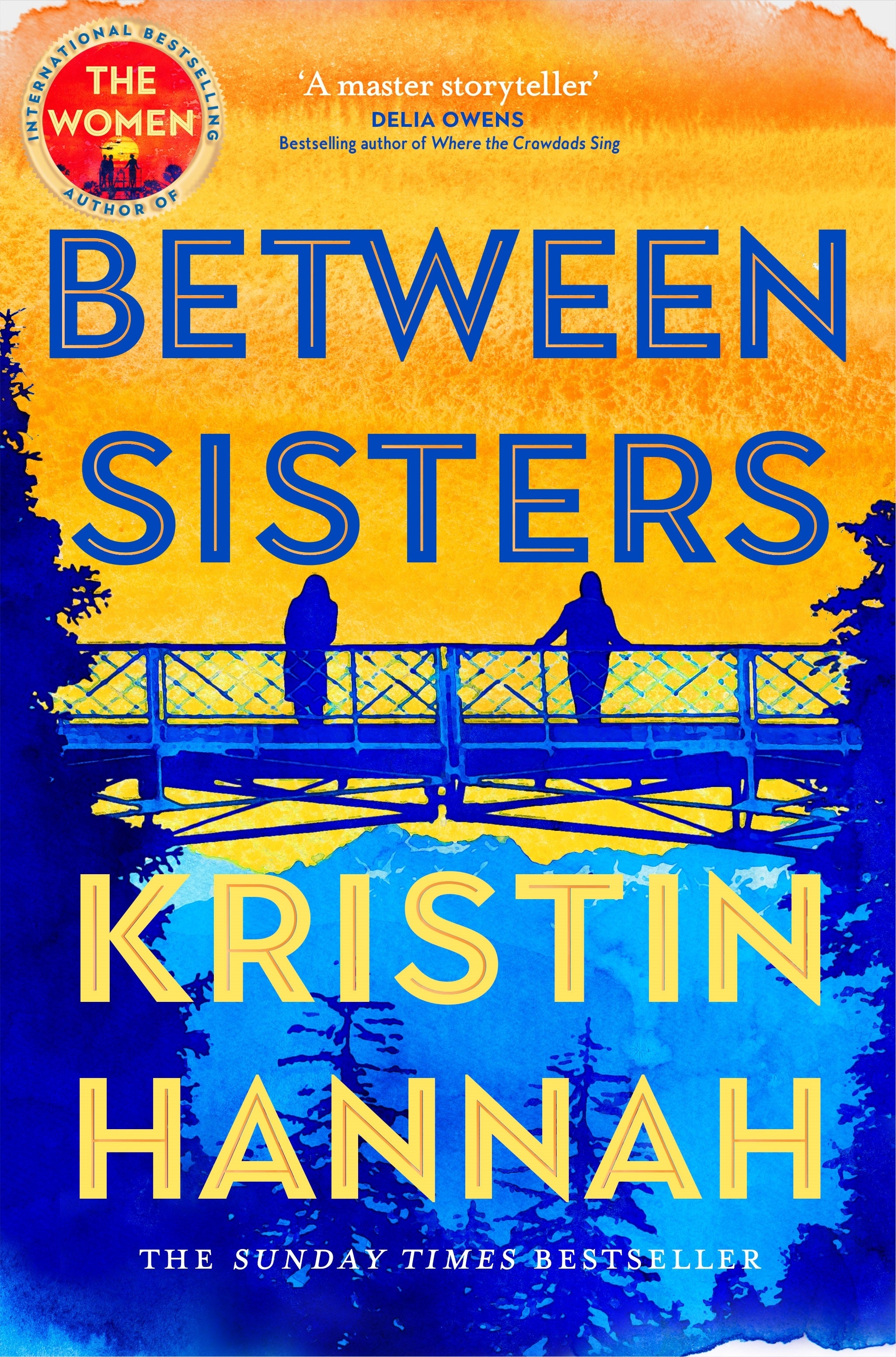 book cover of Between Sisters by Kristin Hannah showing two women standing on a bridge at sunset