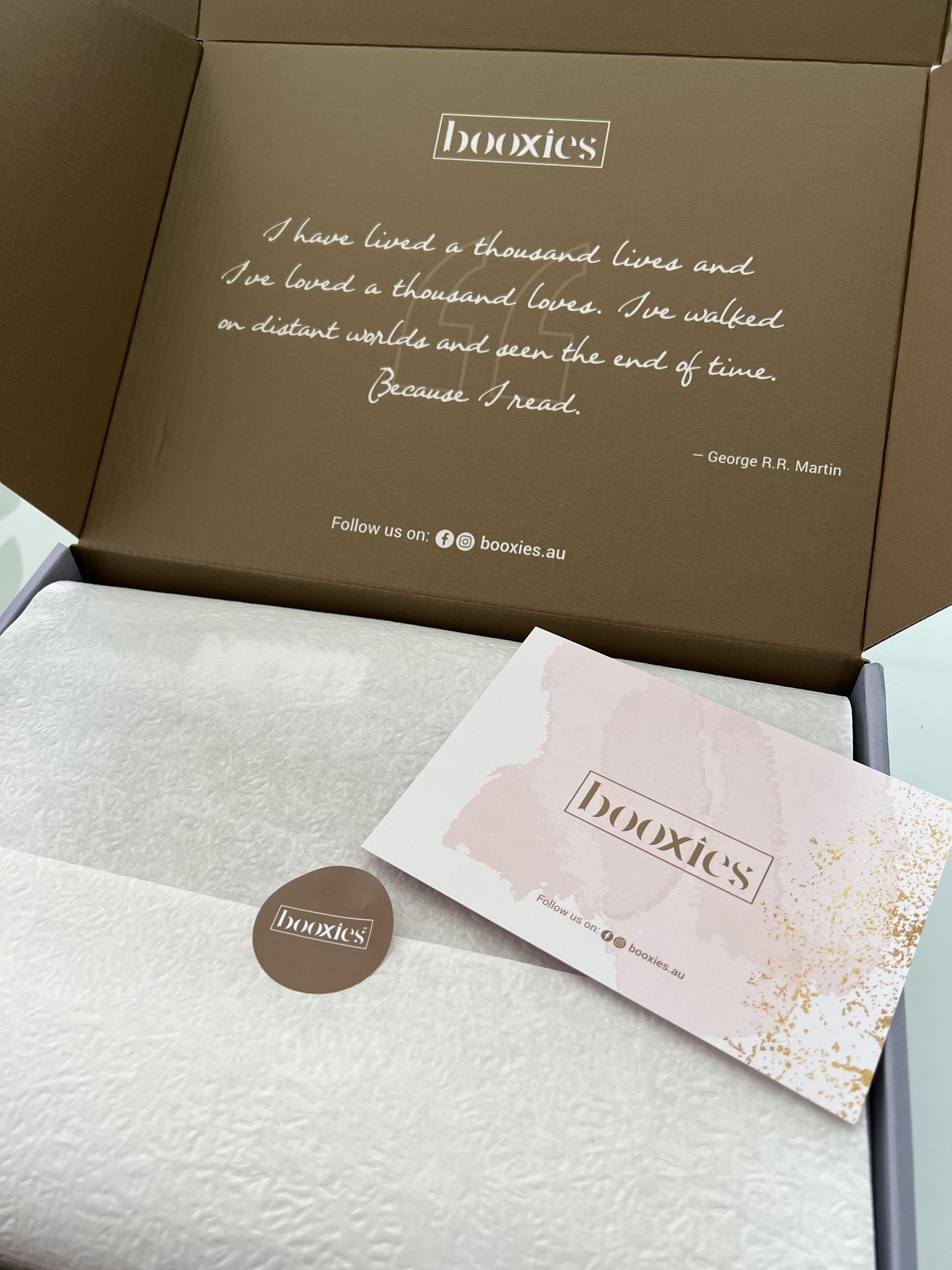 booxies product packaging with quote and branding on a white surface