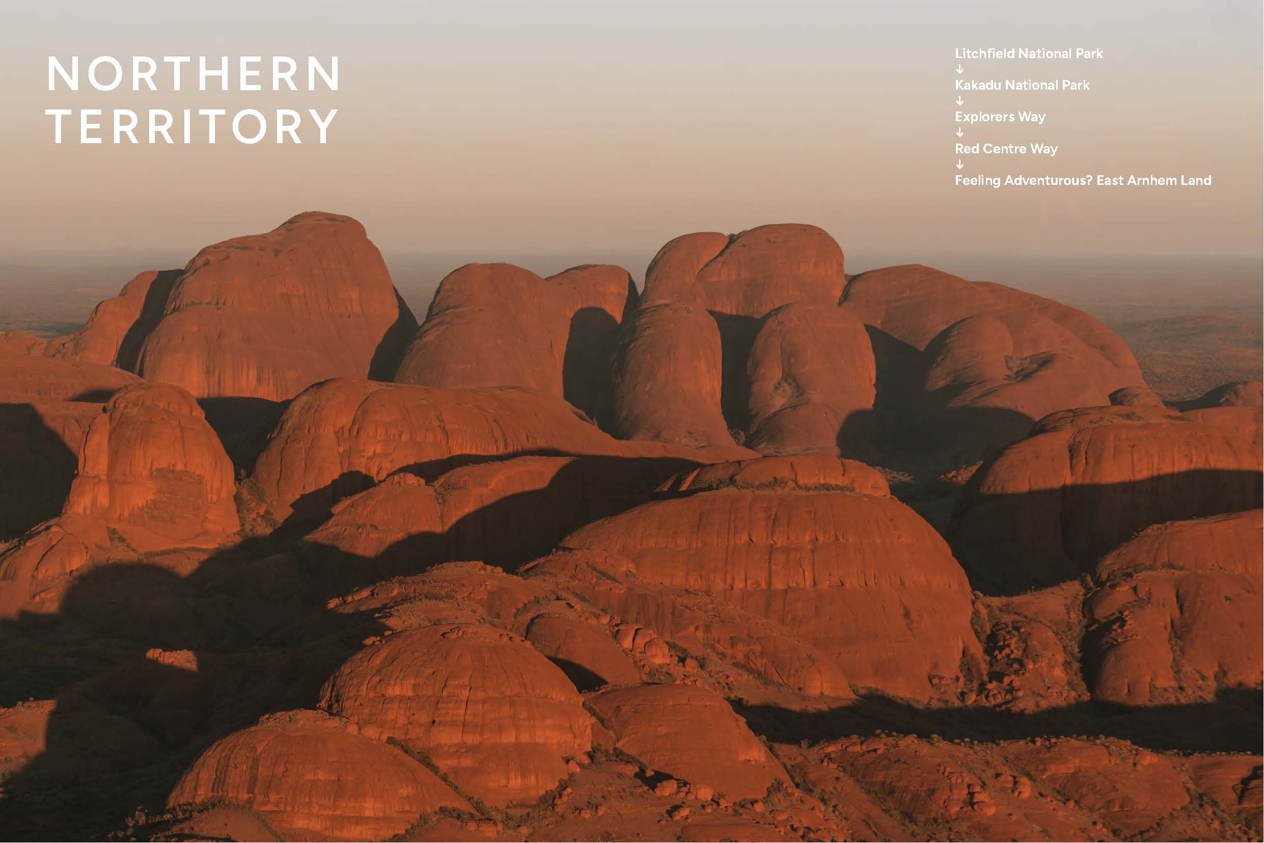 Red rock formations in the Northern Territory with a gradient sky.