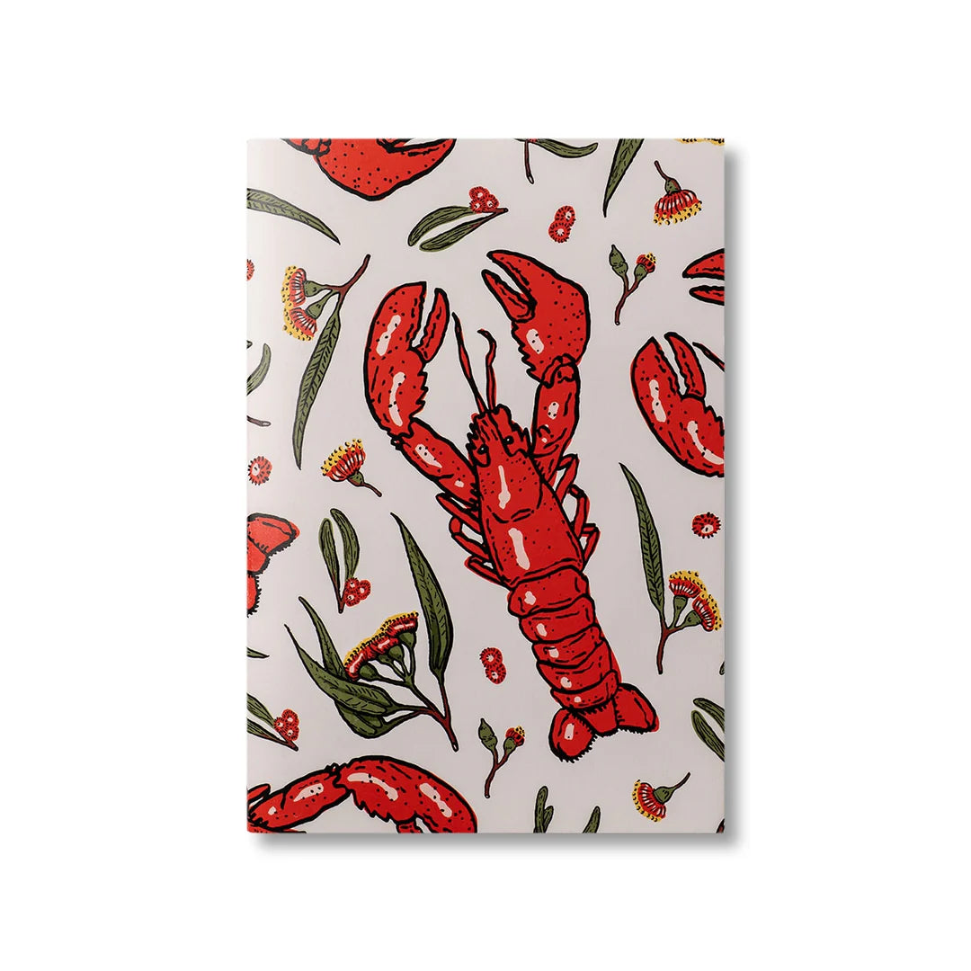 Notebook with red lobster design on a light background